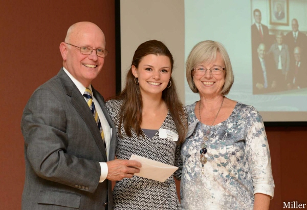 Pictured Above: John C. & Linda Carmon present the 2012 Avon Dollars for Scholars’ Carmon Funeral Home & Family Center scholarship funds to Sarah Hudak (center). Their annual scholarship, based upon academic excellence and community service, is presented to a graduating student, and Avon resident, who is pursuing a career in a caregiving profession. John is President of Avon Dollars for Scholars. (Photograph taken by Michael Miller II)