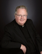 Father Justin  D. Monaghan