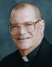 Rev. Denis E. White